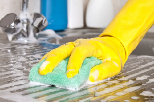 South Kensington cleaners working on high-touch surfaces in a stylish room