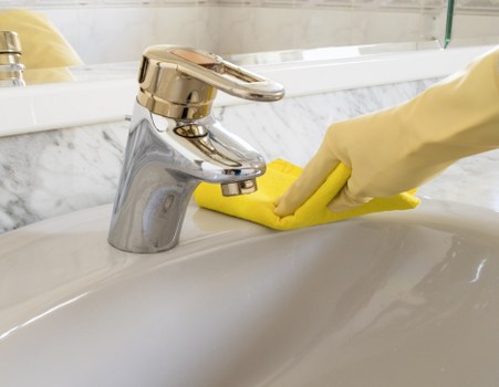 Cleaner vacuuming and dusting during one off cleaning appointment